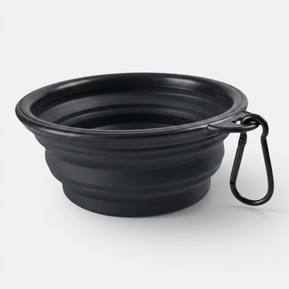 A black collapsible silicone travel bowl for dogs shown open on a plain background.