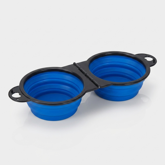 A blue foldable dual bowl feeder sits open and ready for food and water.