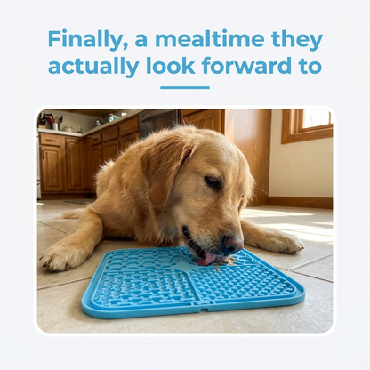 Golden retriever lying on a kitchen floor licking a blue silicone lick mat, with the caption Finally, a mealtime they actually look forward to.