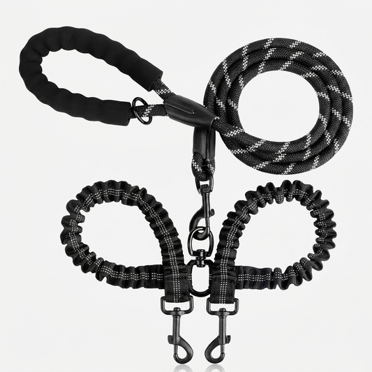 Black reflective no-tangle double dog leash coupler with a padded foam handle, braided rope leash, 360-degree swivel, and two bungee splitter sections ending in metal clasps, shown on a white background.