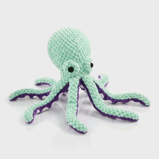 Mint green crocheted plush octopus dog toy with purple striped tentacles displayed on a white background.