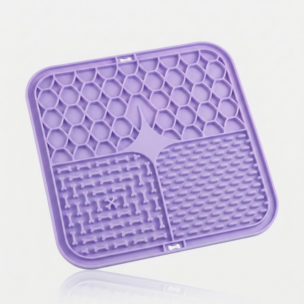 Purple silicone lick mat for dogs with three textured feeding zones, shown at an angle on a white background.