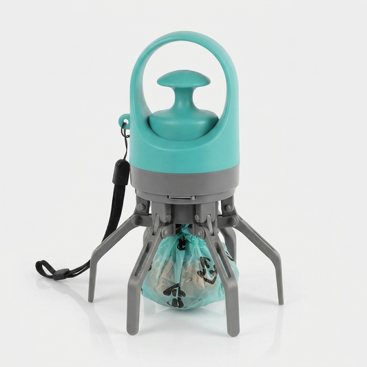 Mint green handheld dog poop scooper with grey six-claw grabber open and a green waste bag loaded, black wrist strap, on a plain white background.