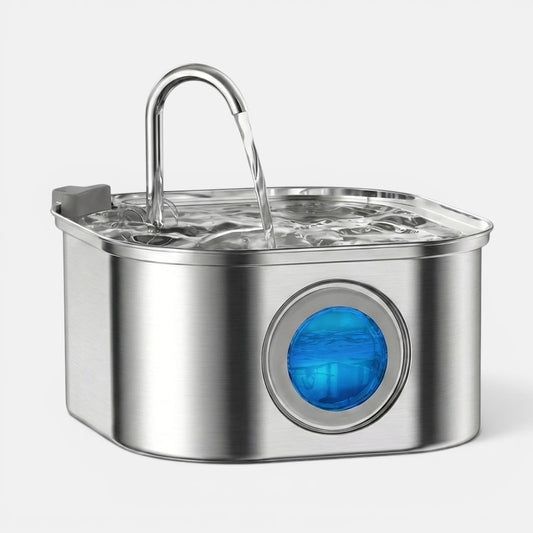 Stainless steel pet water fountain on a white background with an arching water stream and a glowing blue visual water-level window.