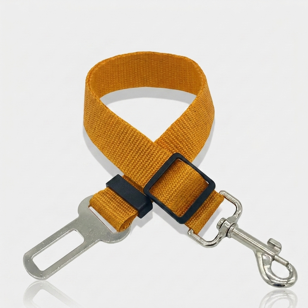 Mustard yellow nylon dog car seat belt tether with a metal seat belt buckle clip, adjustable slider and swivel snap hook on a white background.